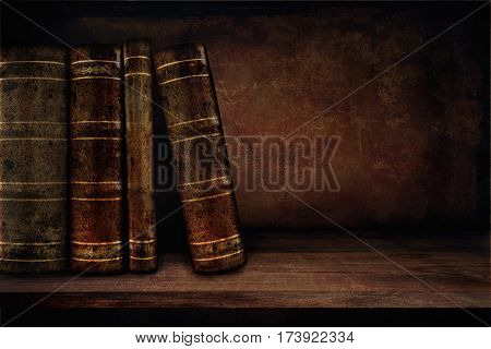 Vintage background with books on a shelf and copy space