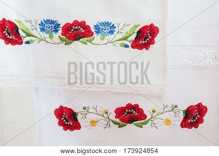 Embroidered Floral Pattern On A White Linen Towel