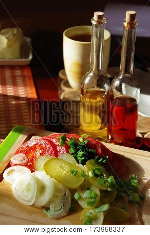 Spring breakfast with fresh vegetables and olive oil