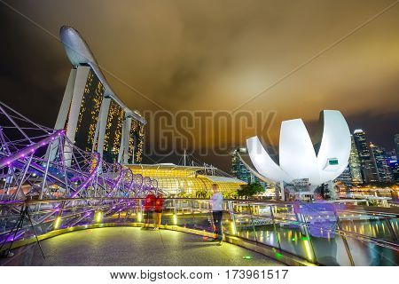 MARINA BAY SINGAPORE - JAN 20 2017: Landscape of the ArtScience Museum Felix bridge and Marina bay sands in Singapore.
