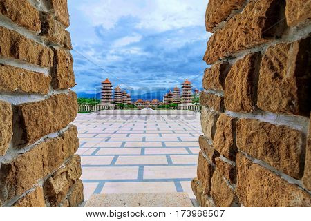 Traditional castle walls with out of focus view of Buddhist mountain