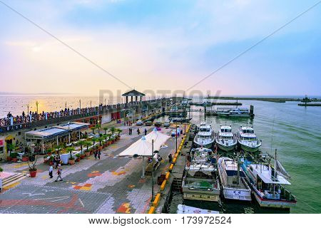 TAIPEI TAIWAN - JANUARY 05: View of Fisherman's wharf waterfront area with boats in Tamsui a popular tourist destinatination on January 05 2017 in Taipei