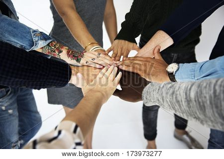 Group of people holding hand assemble togetherness