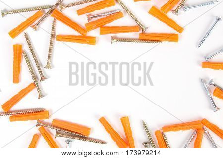 Screws and dowels isolated on white background.