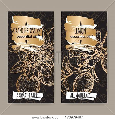 Set of two labels with Orange blossom and lemon branch sketch on elegant black lace background. Aromatherapy series. Great for traditional medicine, perfume design, cooking or gardening.