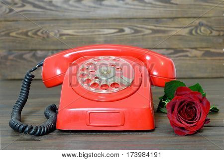 Happy Valentines Day: Vintage red telephone and red rose