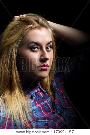 Blonde Girl In A Checkered Shirt And Eyeglasses. Kising Lips.red And Blue Lights.portrait.