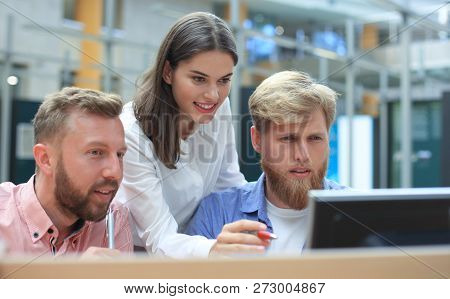 Group Of Young Modern People In Smart Casual Wear Having A Brainstorm Meeting While Standing In The 