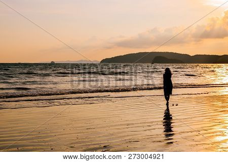Single Young Woman On Beach When Sunset