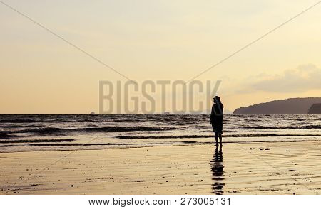 Single Young Woman On Beach When Sunset