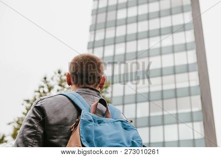A Tourist With A Backpack Or A Guy Arrived To Check Into Apartments Or Watch Sights In A Big City Or