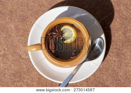 Cinnamon Toddy Consisting Of Cinnamon, Black Pepper, Cardamom, Star Anise, Lemon, Cloves And Hot App
