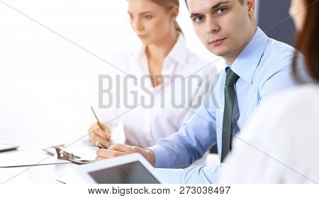 Group Of Business People Or Lawyers Discussing  Terms Of Transaction In Office. Colleagues Working A