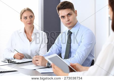Group Of Business People Or Lawyers Discussing  Terms Of Transaction In Office. Colleagues Working A