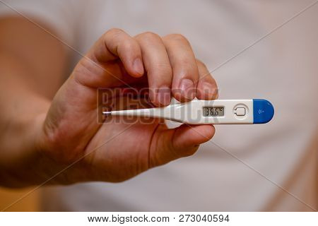 The Temperature Of A Healthy Person On The Thermometer