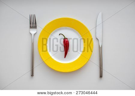 Empty Plate Served With Red Hot Pepper