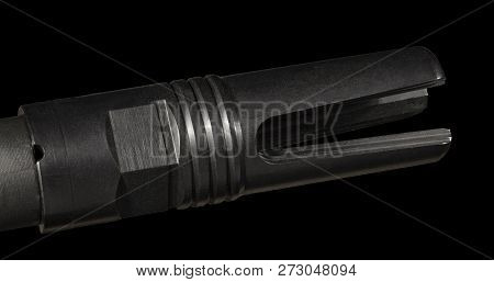 Flash Hider On An Ar-15 With A Black Background