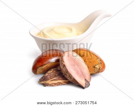 Shea Nuts With Butter Or Cream In The Bowl. Isolated On White Background.