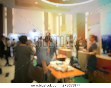 Blurred Image Of People Walking On A Trade Fair Exhibition Or Expo Where Business People Show Innova