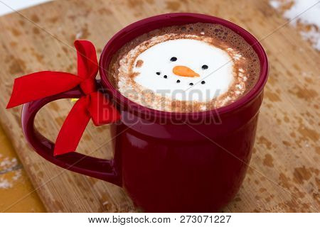 Hot Cocoa Beverage Mixed With Irish Whiskey Garnished With A Smiling Snow-person Marshmallow