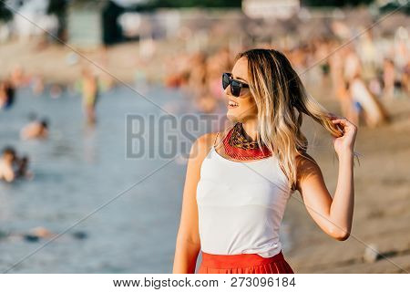 Romantic Girl With Sunglasses Standing At The Beach