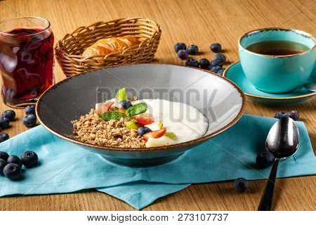 Rice Porrige With Strawberry On Breakfast In Cafe