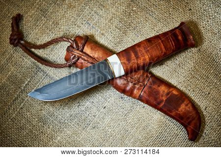 Hunting Knife With A Wooden Handle With Lambskin