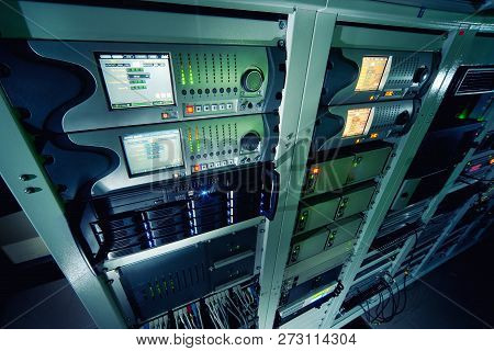A Worker In The Server Room Connects The Cables To The Server