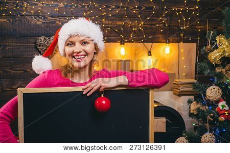 Woman Holding A Black Desk For Text. Black Board Copy Space. Woman With Red Christmas Present Boxes.
