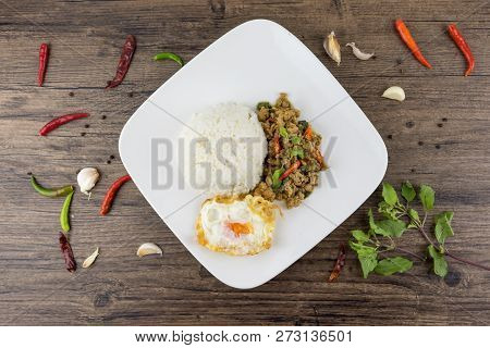 Spicy Thai Basil With Crispy Chicken And Egg (pad Krapow Gai) On Table . It Is A Very Delicious Thai