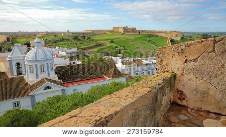 The Church And The Village Of Castro Marim Viewed From The Castle And With Sao Sebastiao Fort In The