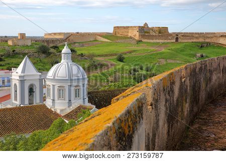The Church And The Village Of Castro Marim Viewed From The Castle And With Sao Sebastiao Fort In The