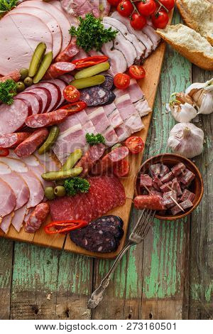 Charcuterie Board With Sausages And Smoked Meat. Top View.