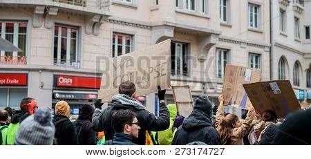 Strasbourg, France - Dec 8, 2018: We Collapse Message On Placard As Crowd Marching In Central Strasb