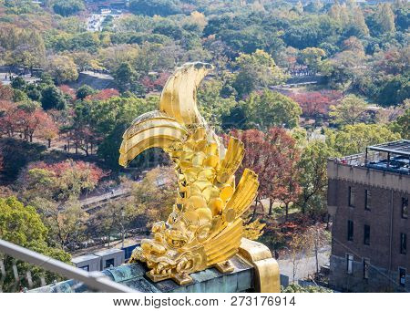 Osaka, Japan, November 25, 2018: Shachihoko (shachi) At World Famous Osaka Castle Roof In Autumn Wit