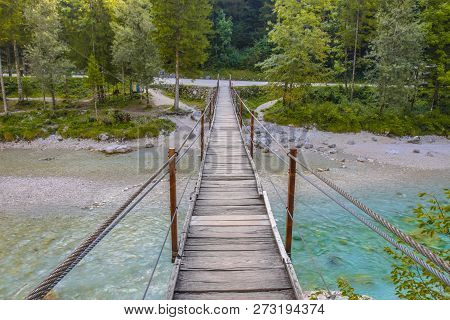 Swingbridge Over Soca River Near Bovec In Triglav National Park, Slovenia, Europe.