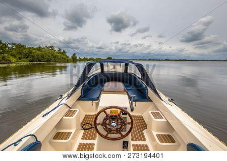 Boat Sailing On Lake Sneekermeer In Friesland