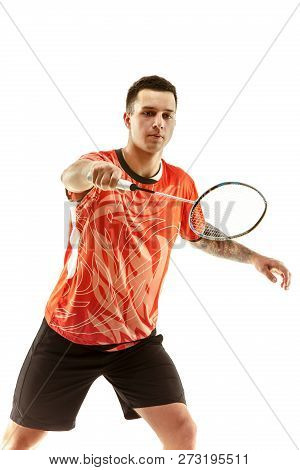 Young Man Playing Badminton Over White Studio Background. Fit Male Athlete Isolated On White. Badmin