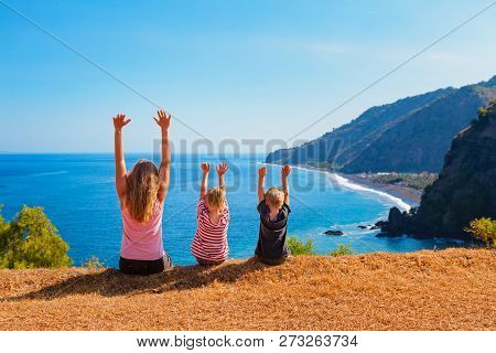 Family Vacation Lifestyle. Happy Mother, Kids On Hill With Scenic View Of High Cliffs, Fishers Villa