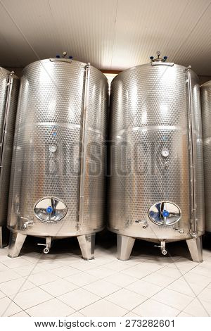 Modern Wine Factory With New Large Tanks For The Fermentation. Modern Wine Cellar With Stainless Ste