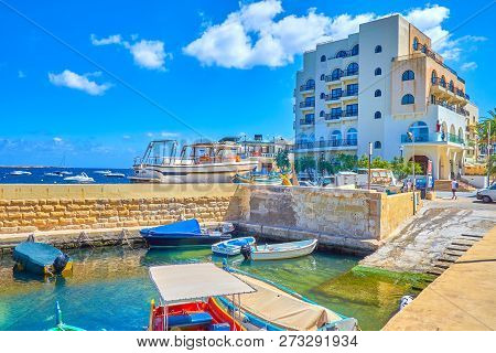 Bugibba, Malta - June 14, 2018: The Modern Seaside Hotel Neighbors With Small Harbor, Called Menqa W