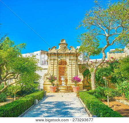 Naxxar, Malta - June 14, 2018: The Stone Fountain In Palazzo Parisio Garden Built In Antique Style W