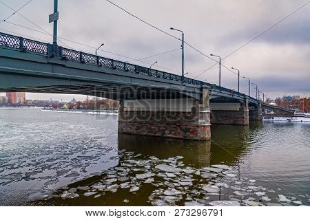 Novospassky Bridge Over The River Moscow During The Winter, The Water Floes, Cloudy Day.