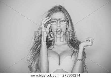 Optics Shop Concept. Woman With Big Breasts Wears Old Fashioned Eyeglasses For Vision. Girl Short Si