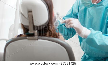 Woman receiving a dental treatment