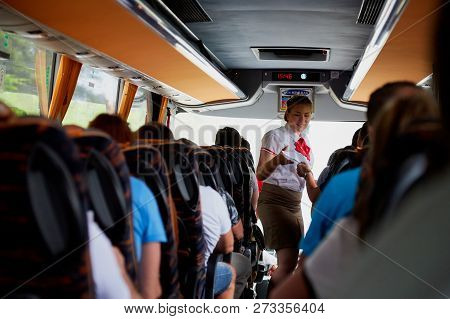 Marmaris, Turkey - May 26, 2018: Female Guide In The Bus With Tourists. People During Travel. Transf