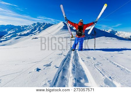 Skitouring with amazing view of swiss famous mountains in beautiful winter powder snow of Alps. 