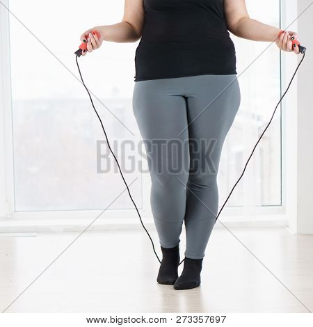 Weight Loss, Endurance, Jump-fit, Vitality, Active Lifestyle. Overweight Woman With Jumping Rope Car