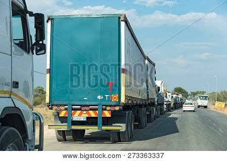 Kazungula, Botswana-november 17, 2018: Trucks Are Waiting For The Kazungula Ferry Across The Zambezi