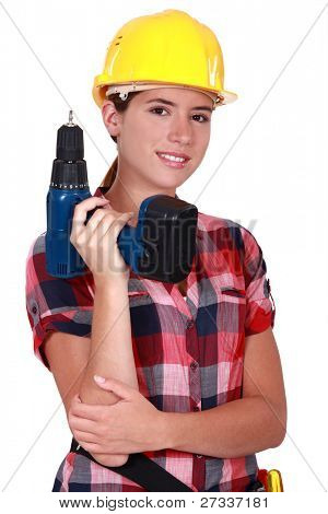 Tradeswoman 持有一种电池供电的电动工具